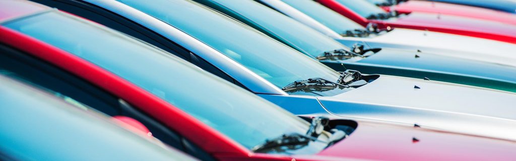 Row of colorful vehicles parked side by side