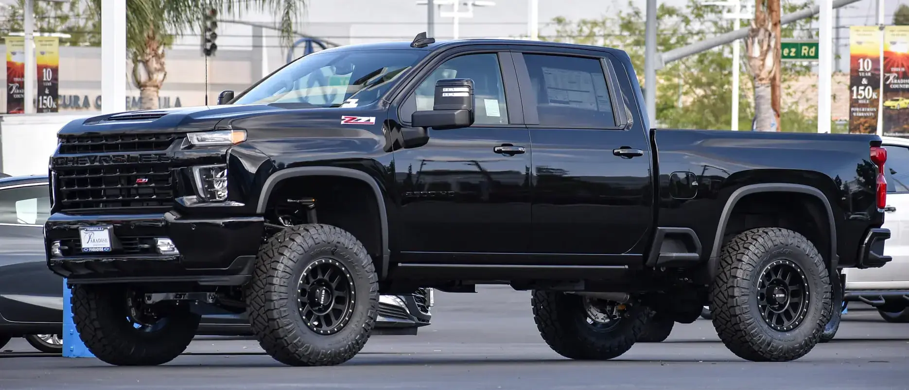 lifted black pick-up truck